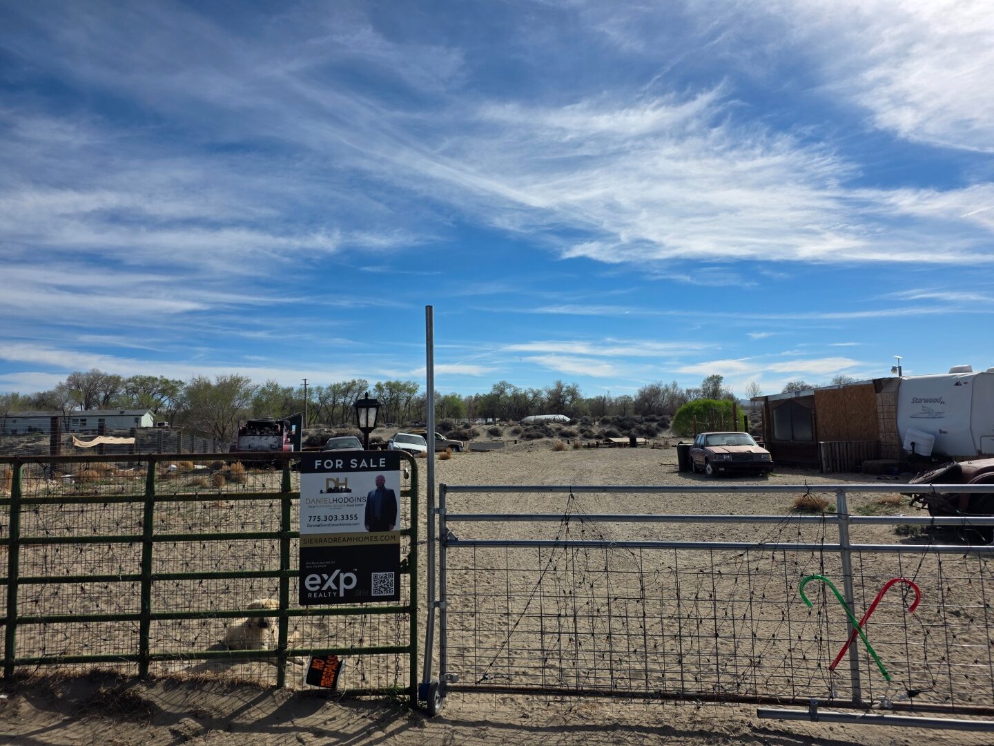 Property entrance with Daniel Hodgins For Sale sign