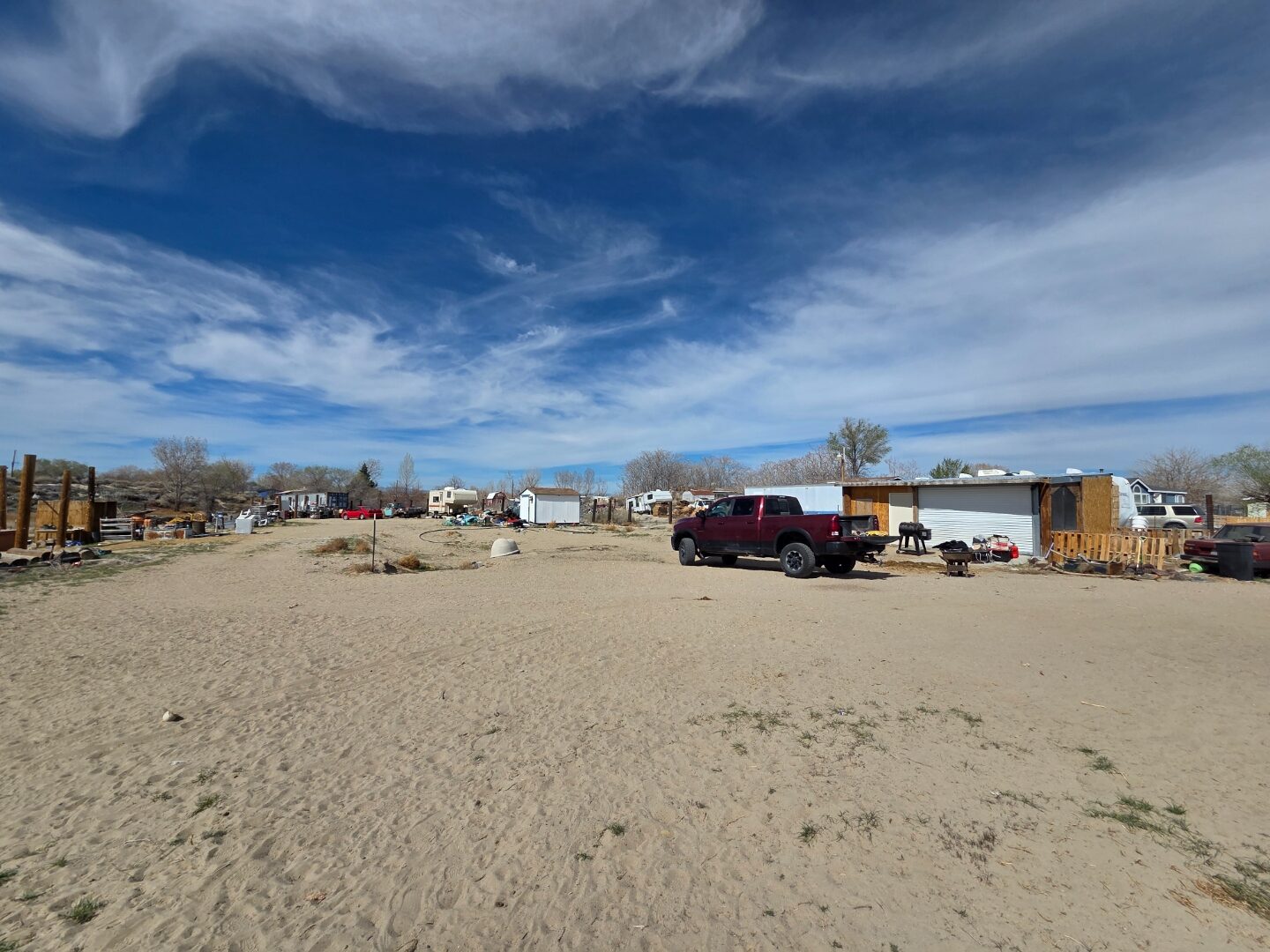 Ground-level property view with outbuilding