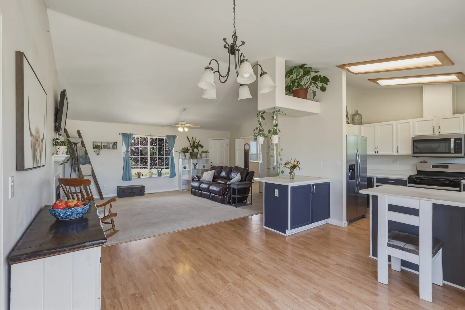 Open kitchen-to-living floorplan with vaulted ceilings