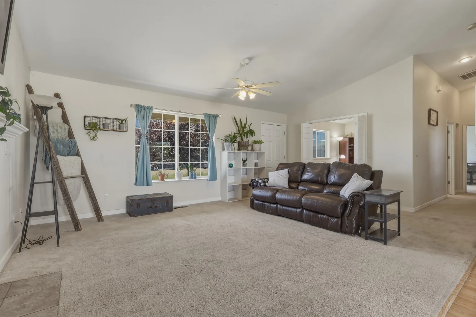 Living room with large picture window and gas fireplace