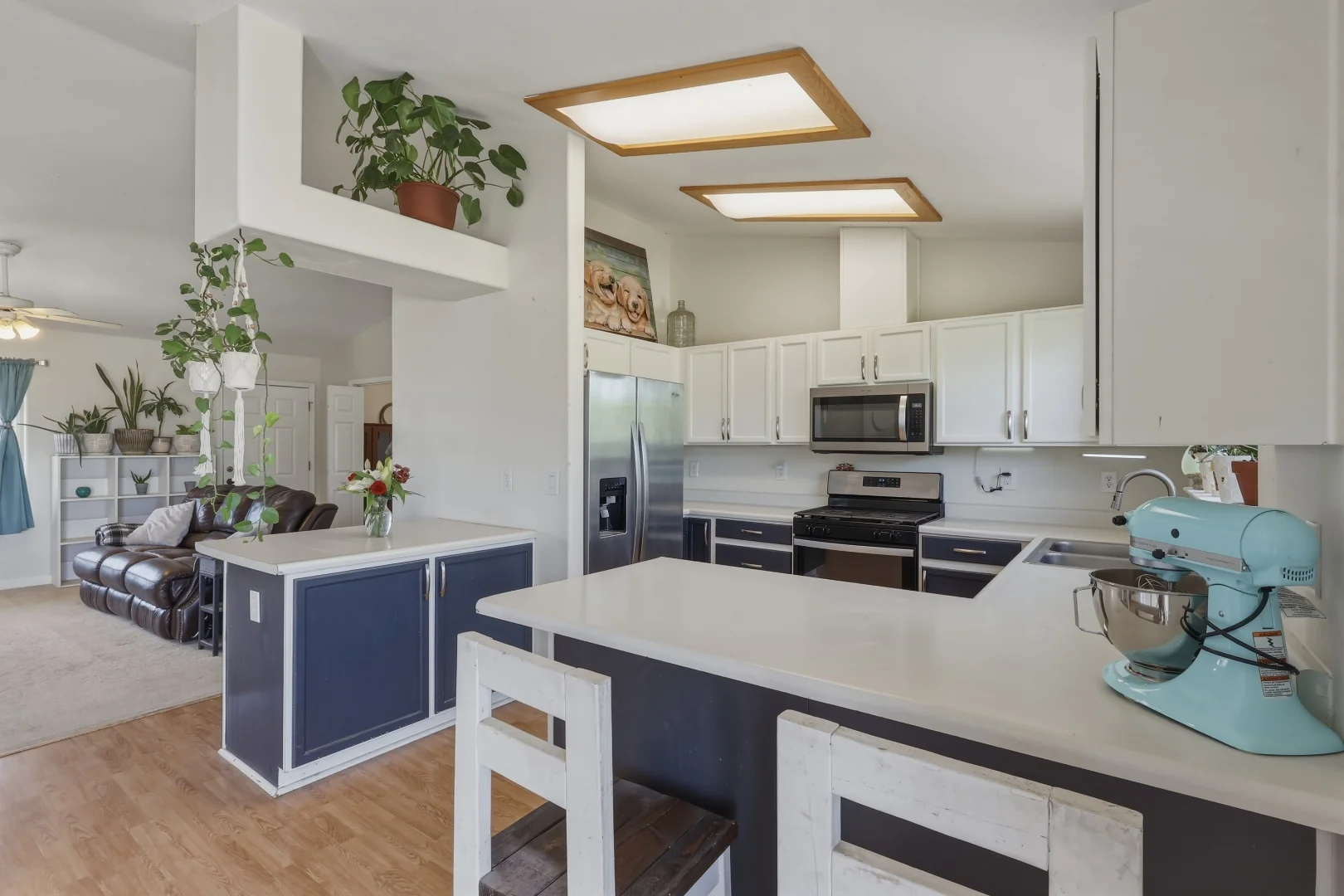 Kitchen from the dining side showing open sight lines to the living room