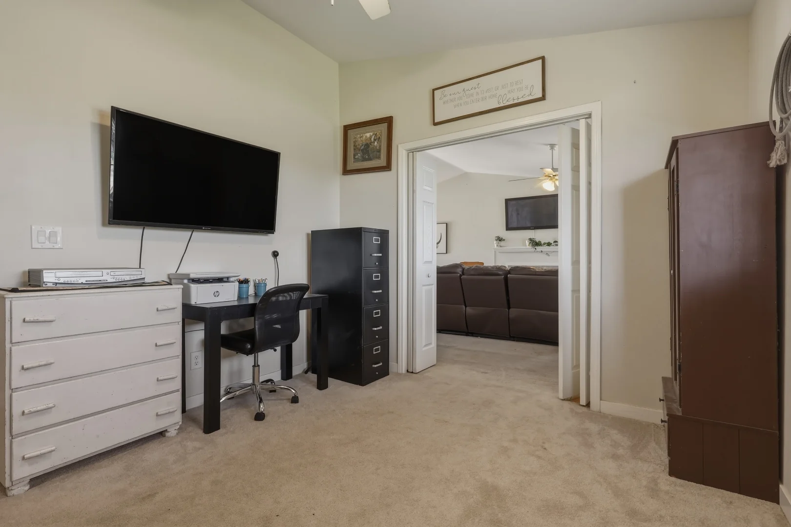 Bifold doors from the flexible 4th bedroom opening into the living room